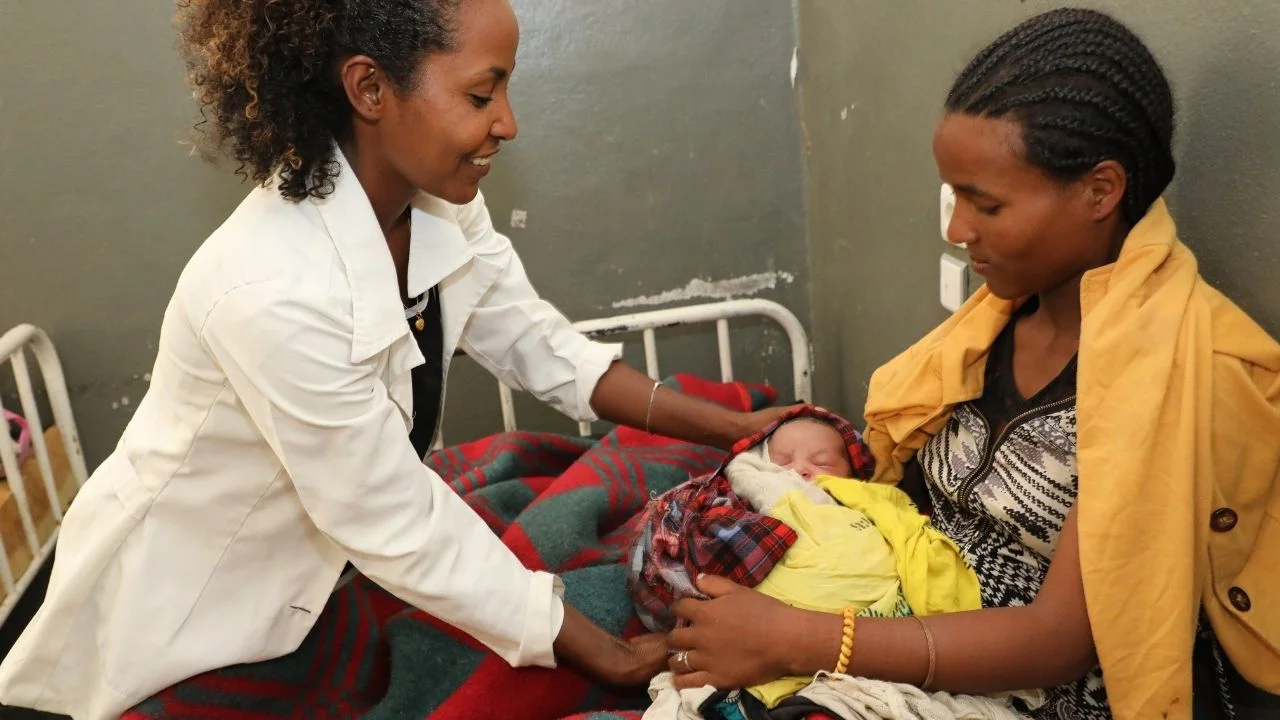 nurse, mother and baby